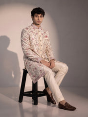 Beige floral embroidered silk indowestern for men - seated pose