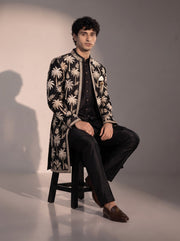 Black palm embroidered silk indowestern for men - seated pose