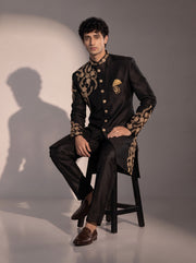 Black silk embroidered indowestern for men - seated pose