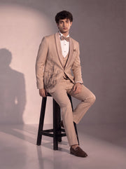 Fawn bamboo embellished tuxedo suit for men - seated pose