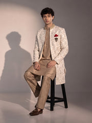 Ivory paisley embroidered silk indowestern for men - seated pose