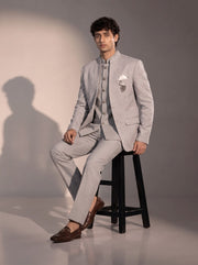Light grey textured jodhpuri indowestern suit for men - seated pose
