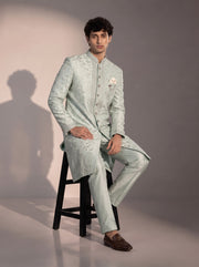 Mint embroidered silk indowestern for men - seated pose